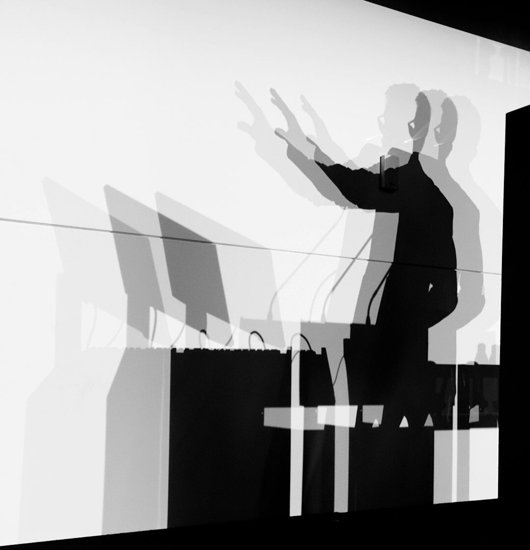 Speaker presenting to an audience in an auditorium